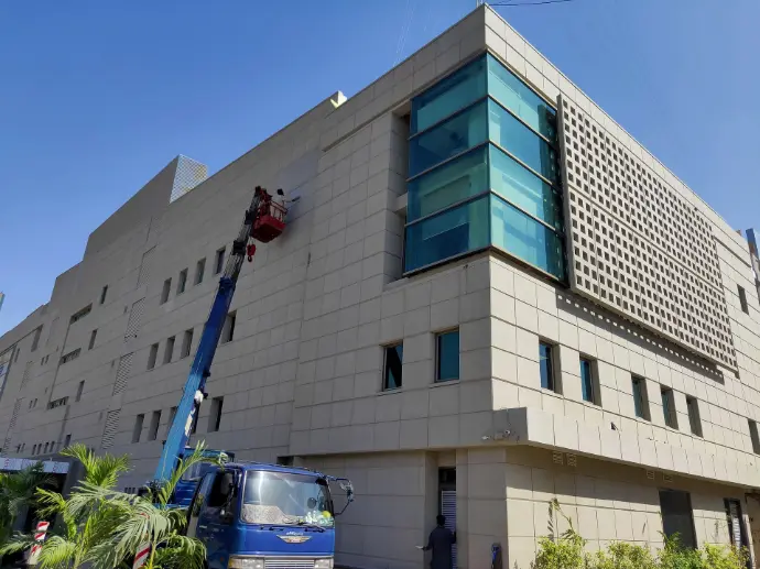 ABL Clifton CemTrox coating over heafoffice building of a large bank in Karachi. Building facade has well defined panels with grooves, coated finished in fairface concrete color. A timeless classic look.