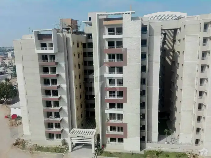 Six highrise residential towe rcomplex coated with CemTrox. The facade is coated predominantly in ivory color, with dark chocolate, white, and ocher colors are used as accents. 