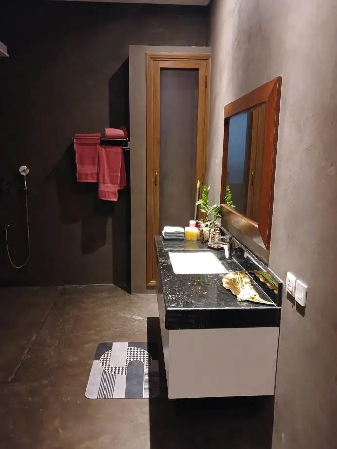 CemPlast in washrooms Cemplast applied in a washroom with seamless polished finsih, replacing vertical tiles. The shower area is also coated with CemPlast.